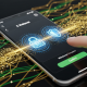 Dynamic digital rendering of funds transferring rapidly from an online casino app to an e-wallet on a mobile phone, with security padlock icons, symbolizing fast and secure withdrawals.